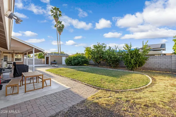 a view of a swimming pool with a table and chairs