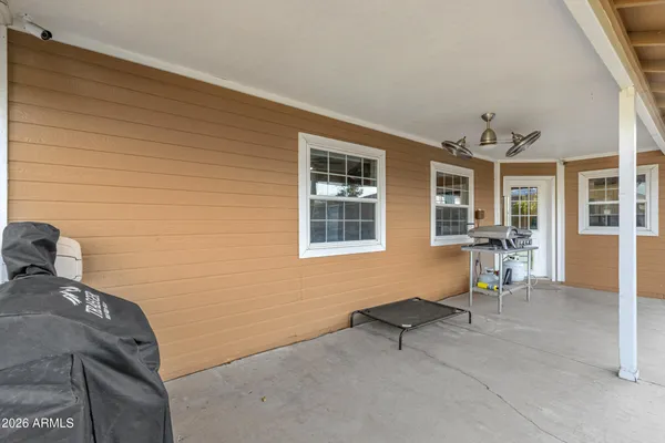 a view of a backyard with a patio and plants
