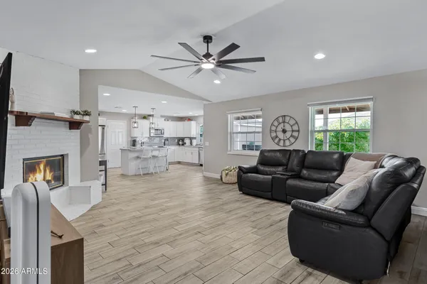 a living room with furniture and a fireplace
