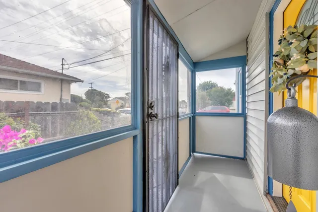 a view of a balcony and wooden floor