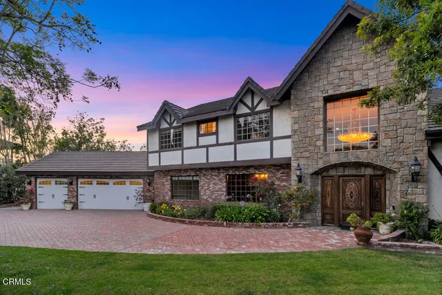 a front view of house with yard and outdoor seating