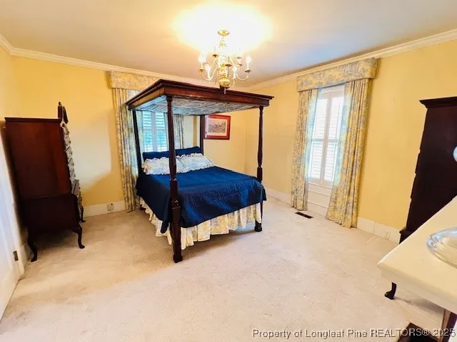 a spacious bedroom with a bed and a dresser