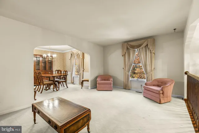 a living room with furniture and a table