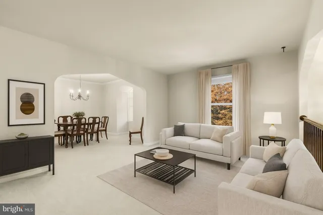 a living room with furniture and a table