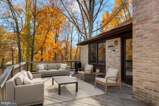 a outdoor space with patio the couches and a fireplace with wooden floor