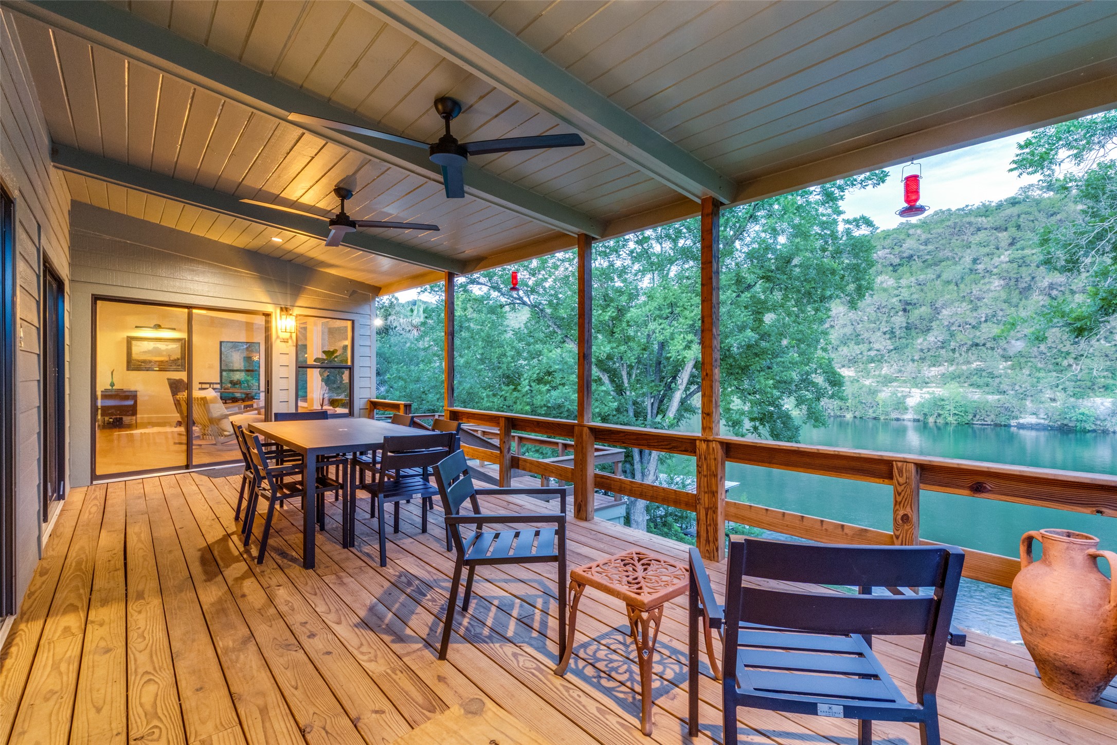 303 Lago Verde Road Austin, TX 78734 - Photo 27 of 39 A spacious covered deck offers scenic water views, perfect for outdoor dining and relaxation.