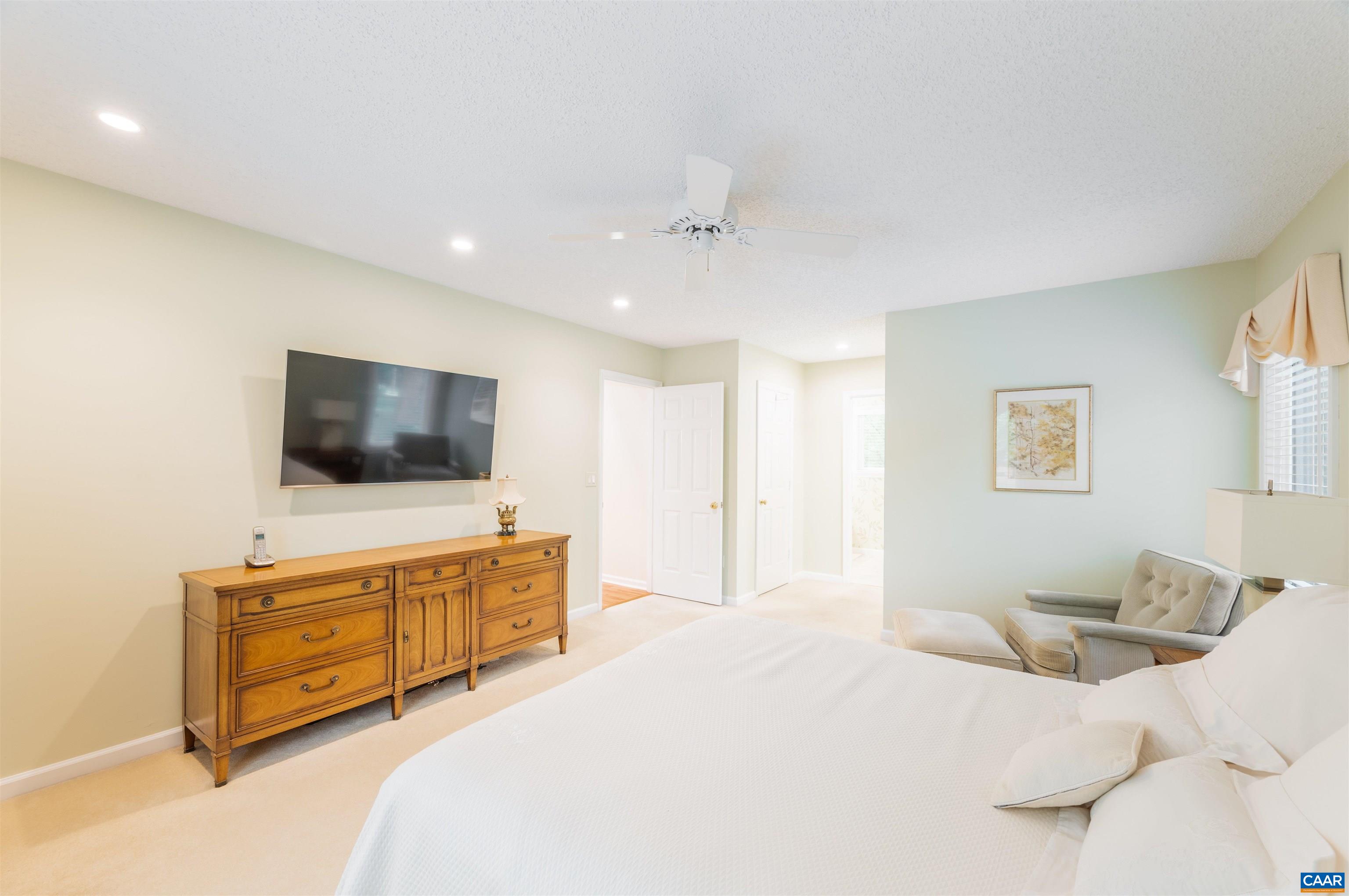 32 Out Of Bounds Road Palmyra, VA 22963 - Photo 20 of 55 a bedroom with a bed and a flat screen tv