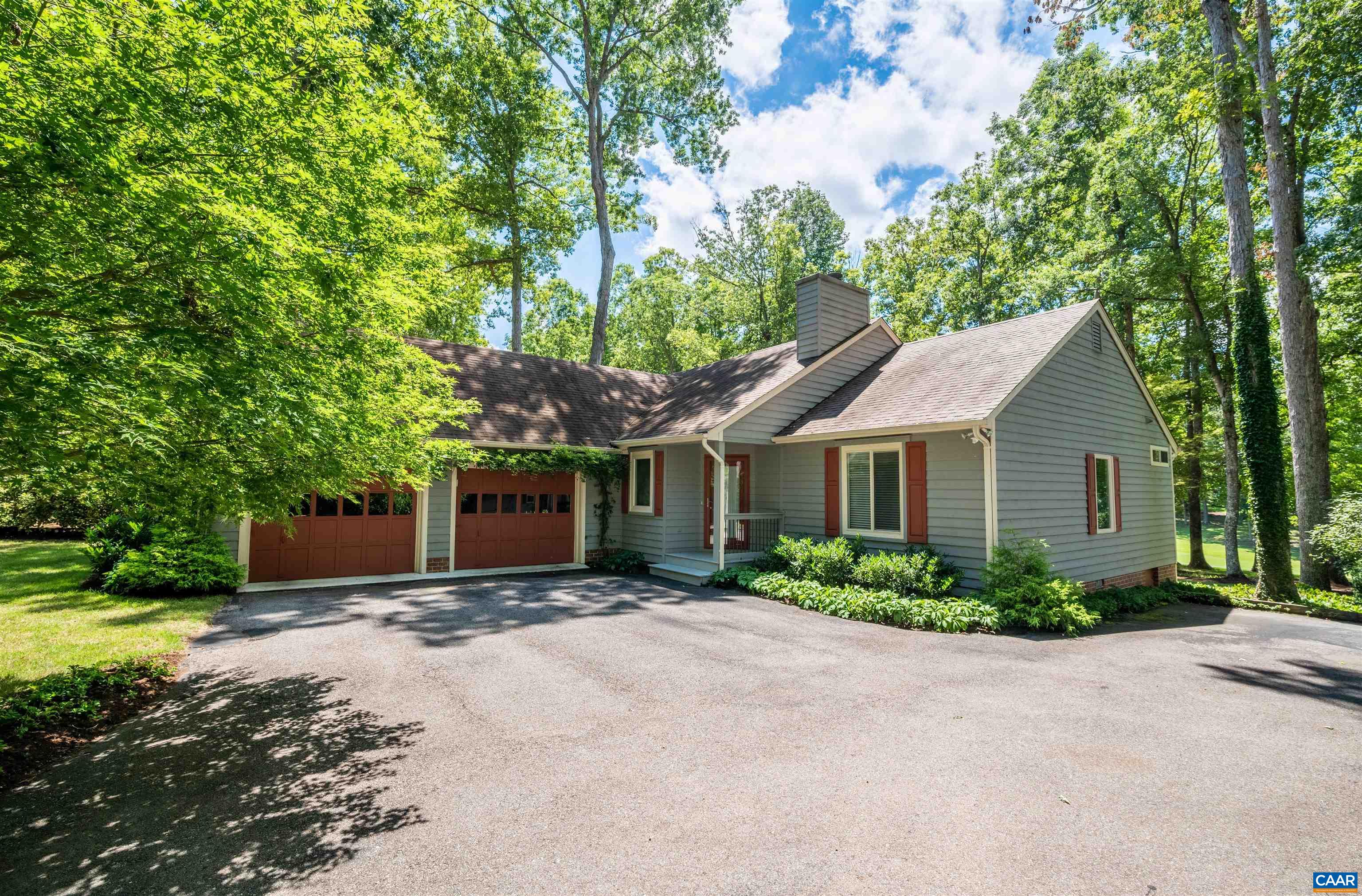 32 Out Of Bounds Road Palmyra, VA 22963 - Photo 2 of 55 a front view of a house with a garden