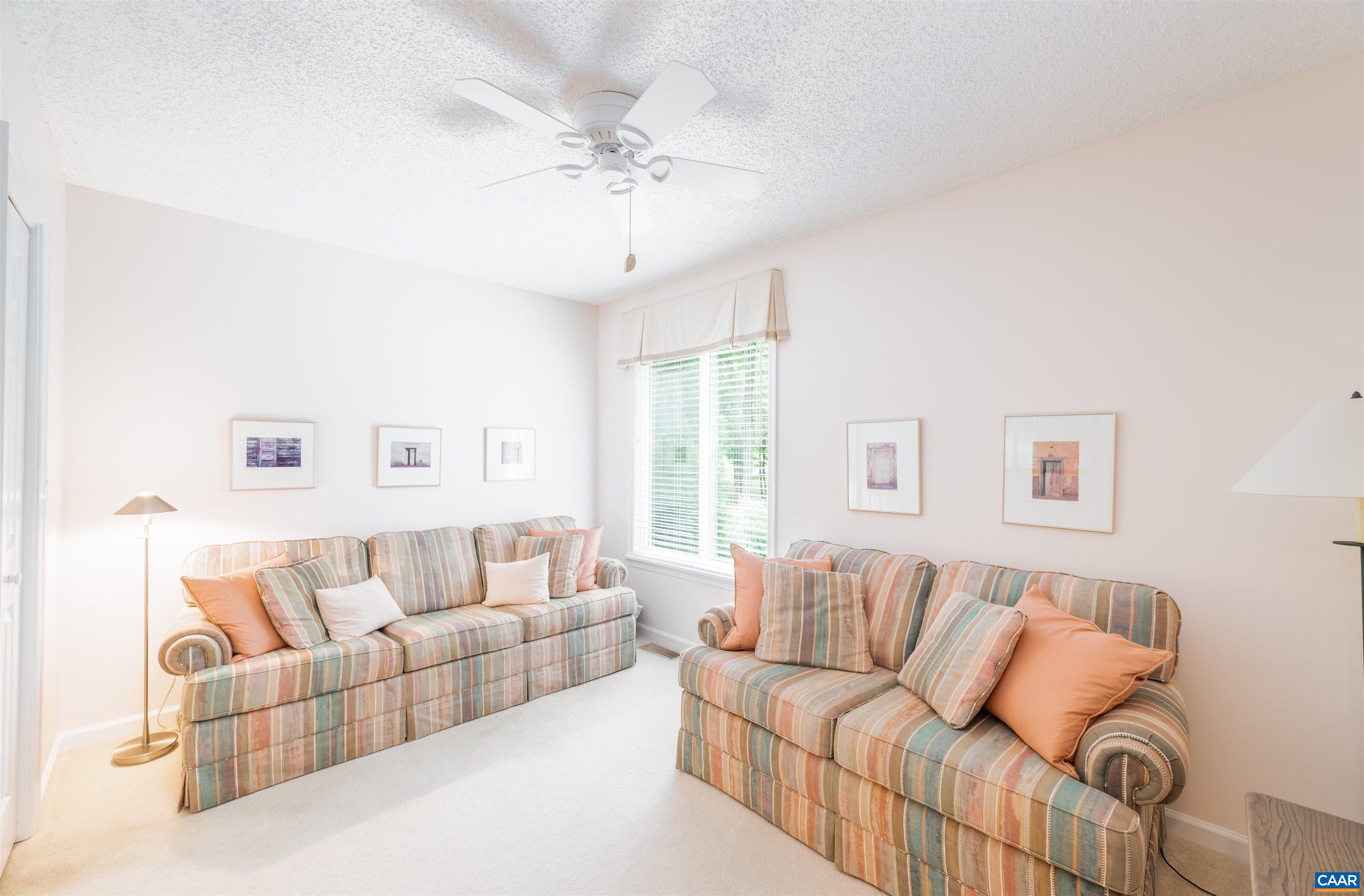 32 Out Of Bounds Road Palmyra, VA 22963 - Photo 26 of 55 a living room with furniture and a large window