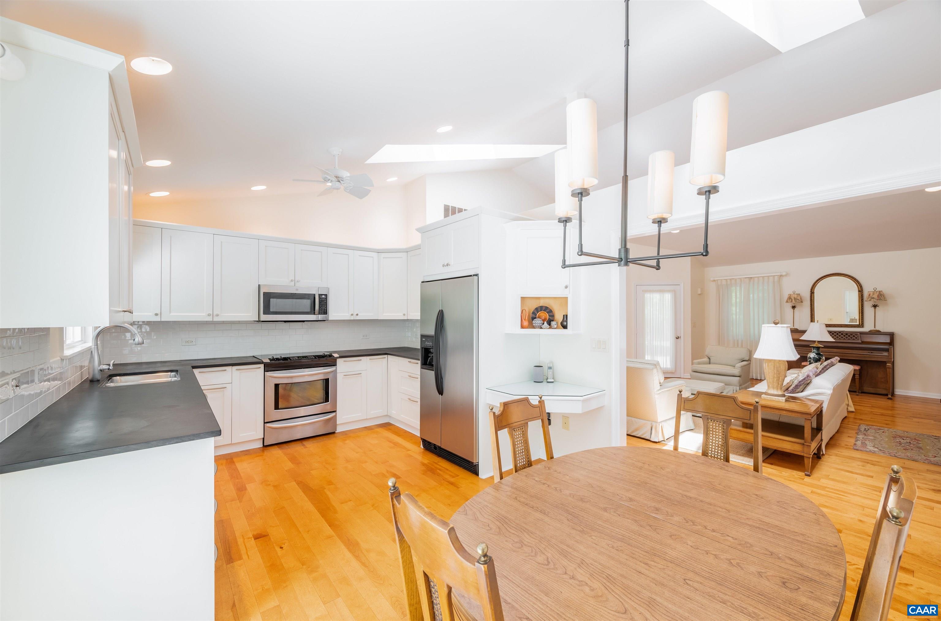 32 Out Of Bounds Road Palmyra, VA 22963 - Photo 3 of 55 a kitchen with stainless steel appliances kitchen island sink refrigerator and stove