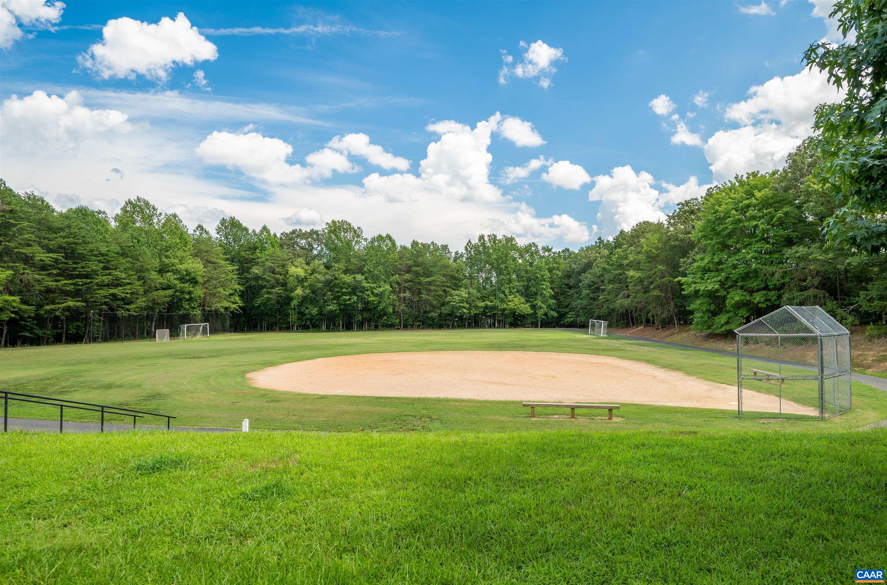 32 Out Of Bounds Road Palmyra, VA 22963 - Photo 43 of 55 a view of a golf course with a lake