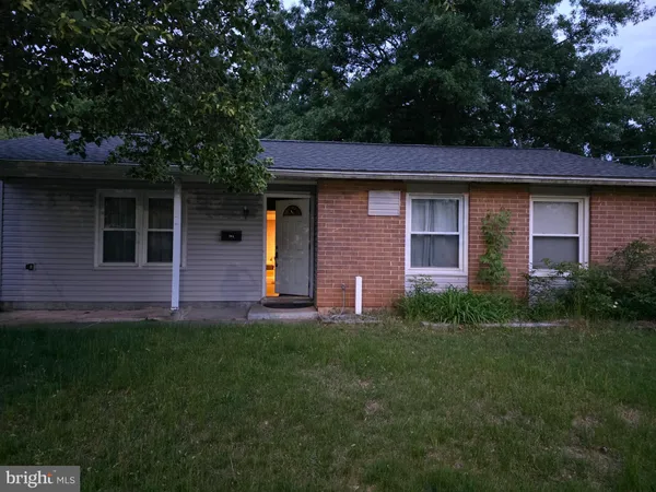 a brick house with a small yard