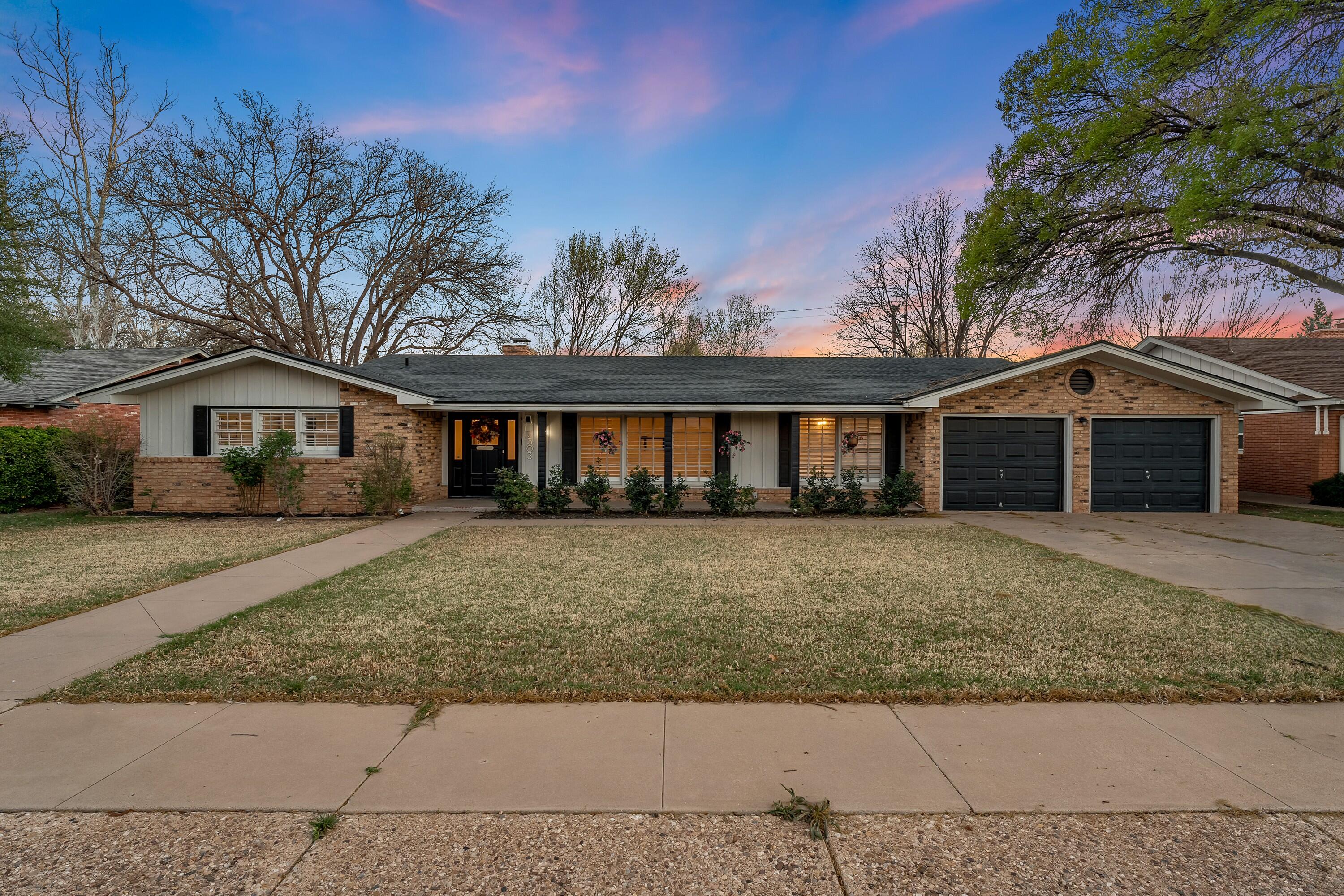 3303 53rd Street Lubbock, TX 79413 - Photo 1 of 72 front view of a house with a yard