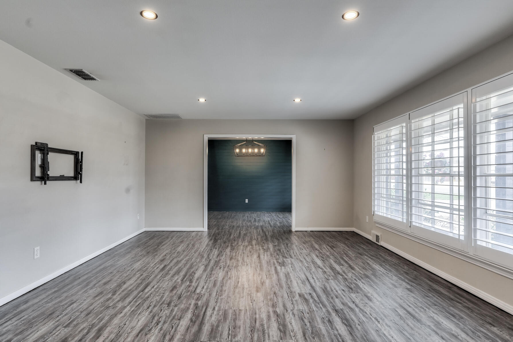 3303 53rd Street Lubbock, TX 79413 - Photo 11 of 72 wooden floor in an empty room with a window