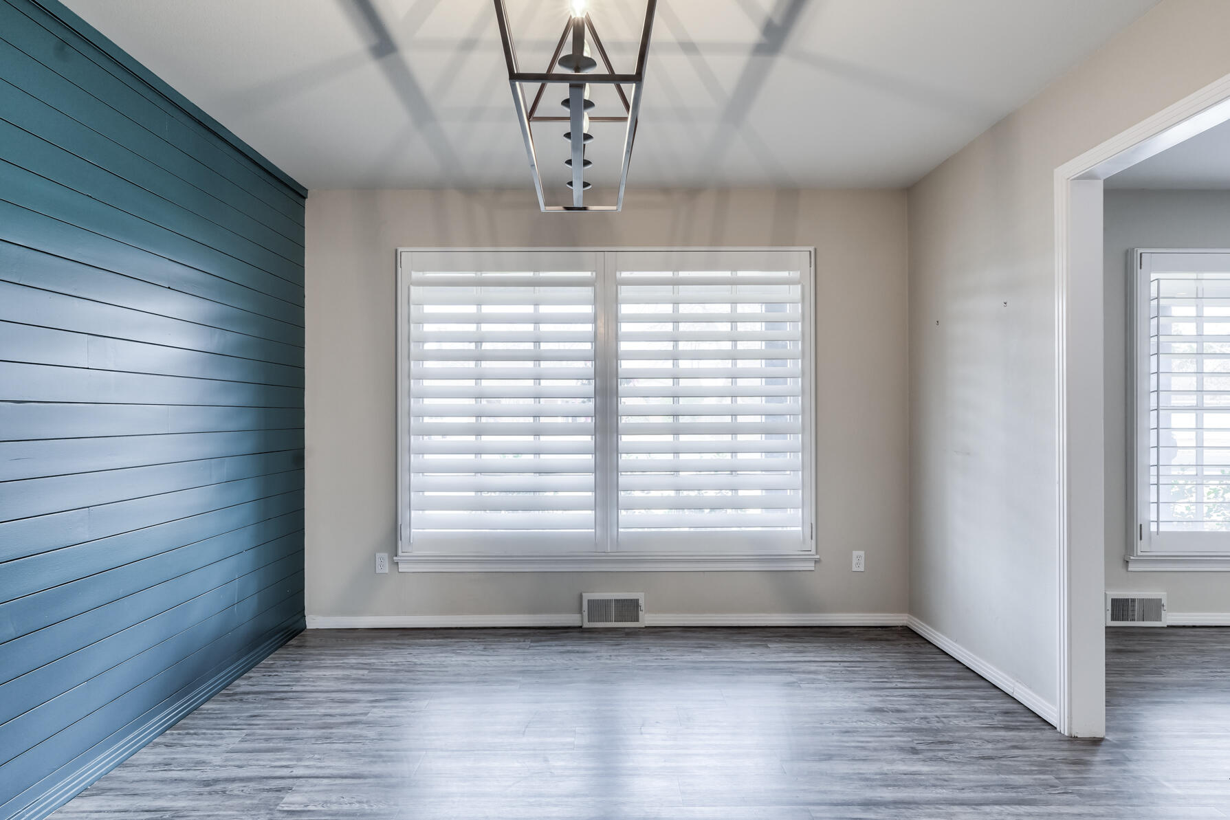 3303 53rd Street Lubbock, TX 79413 - Photo 14 of 72 a view of empty room with wooden floor and fan