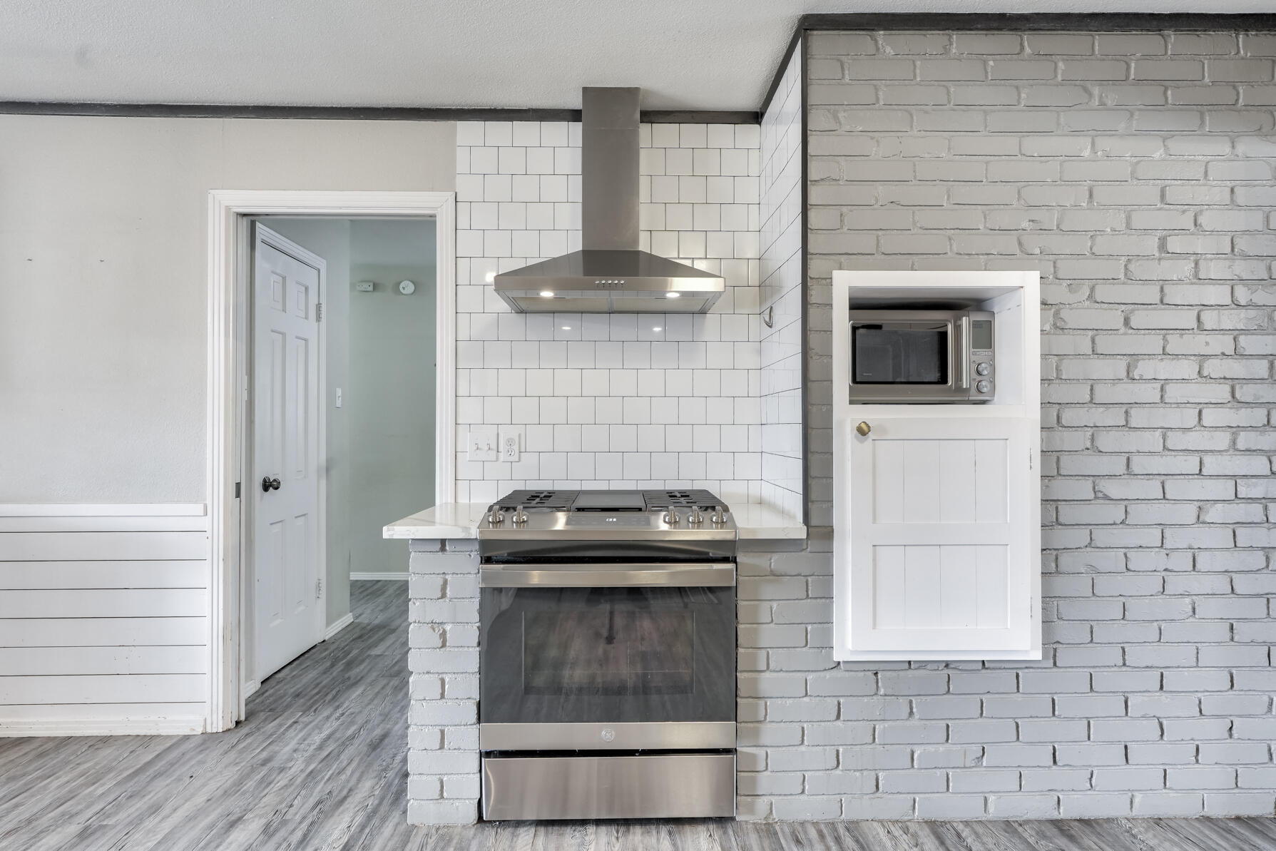 3303 53rd Street Lubbock, TX 79413 - Photo 19 of 72 a stove top oven sitting inside of a kitchen