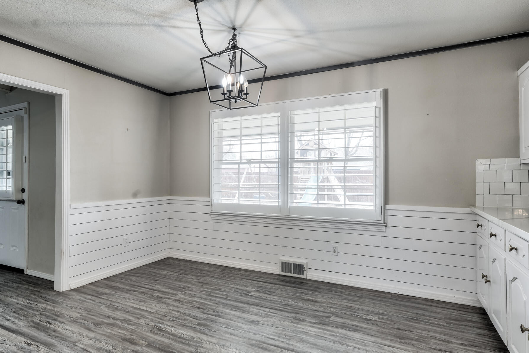3303 53rd Street Lubbock, TX 79413 - Photo 24 of 72 a view of empty room with wooden floor and fan