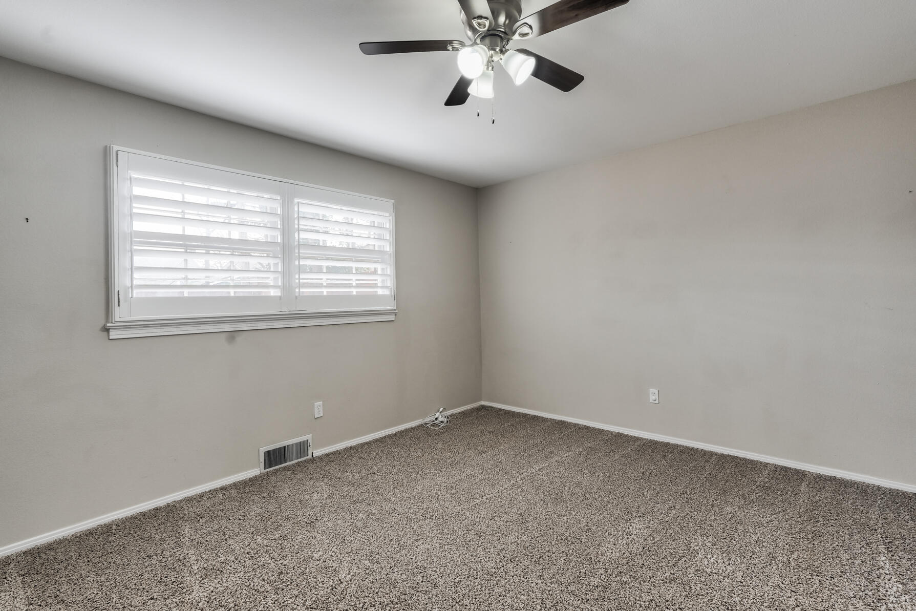 3303 53rd Street Lubbock, TX 79413 - Photo 33 of 72 a view of an empty room with a window