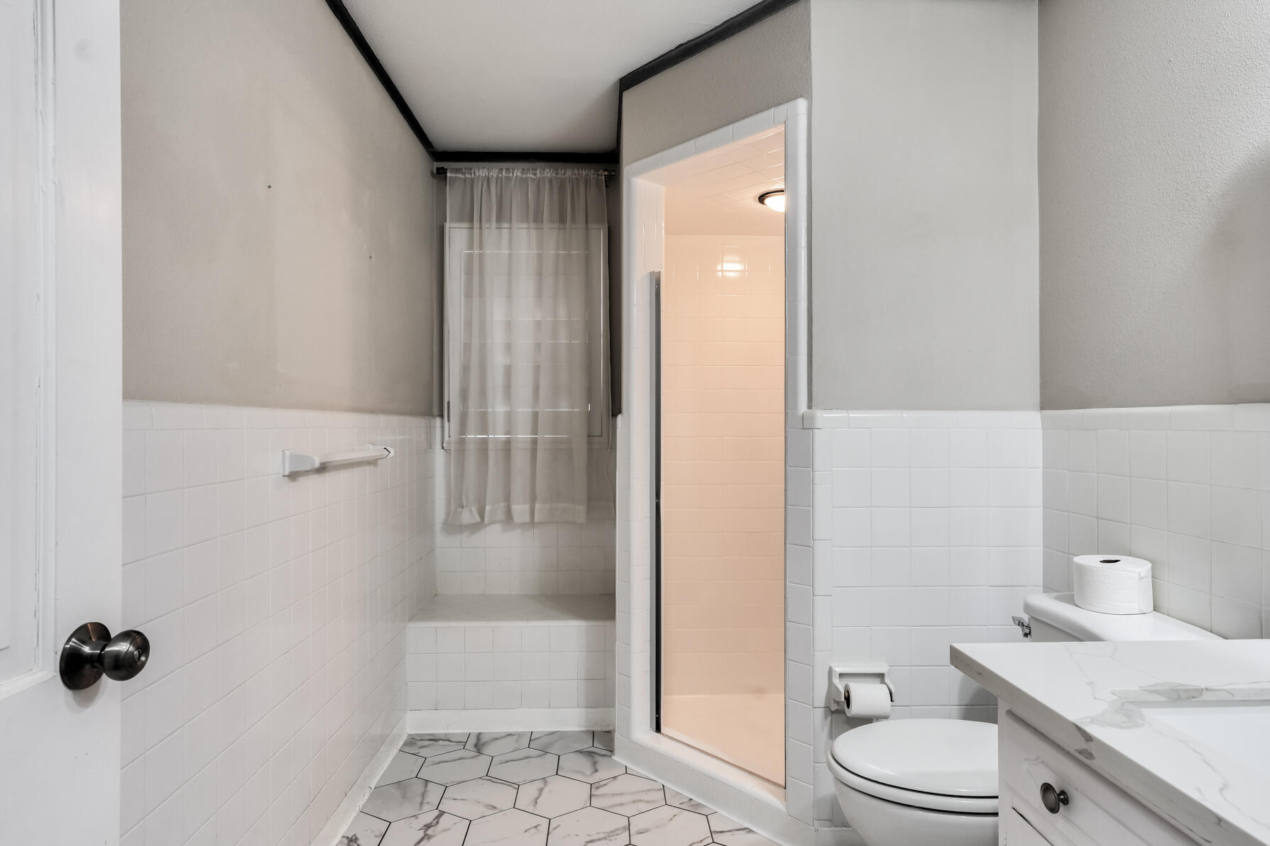 3303 53rd Street Lubbock, TX 79413 - Photo 40 of 72 a bathroom with a granite countertop sink a toilet and shower