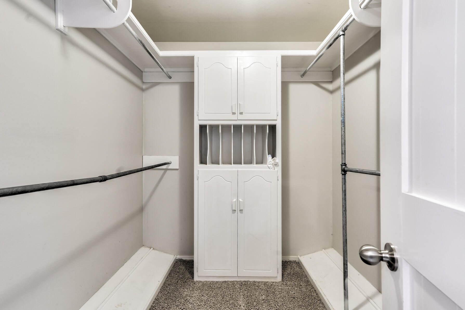 3303 53rd Street Lubbock, TX 79413 - Photo 42 of 72 a view of walk in closet with empty racks