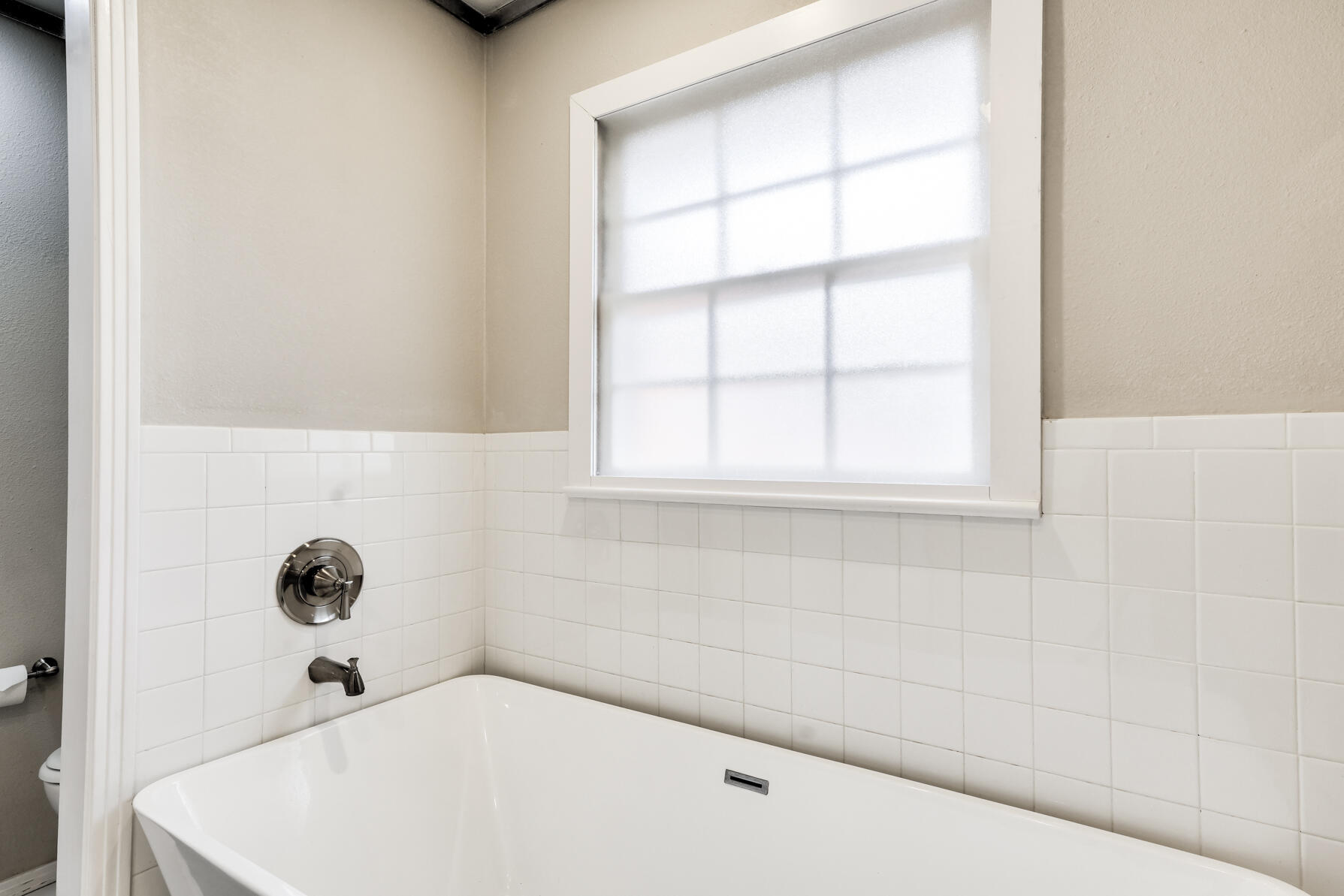 3303 53rd Street Lubbock, TX 79413 - Photo 48 of 72 a bathroom with a bathtub