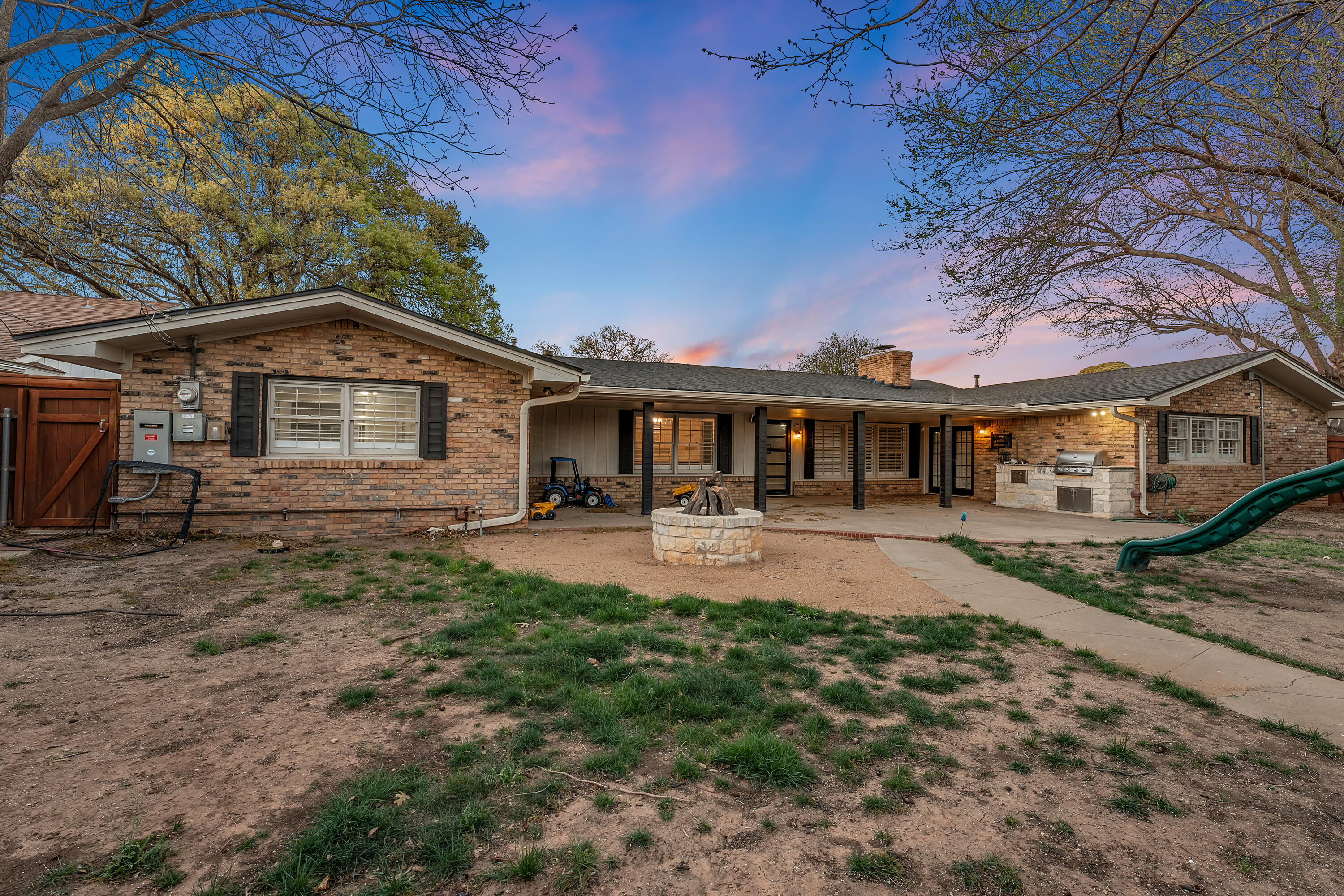 3303 53rd Street Lubbock, TX 79413 - Photo 62 of 72 a front view of a house with yard patio and green space