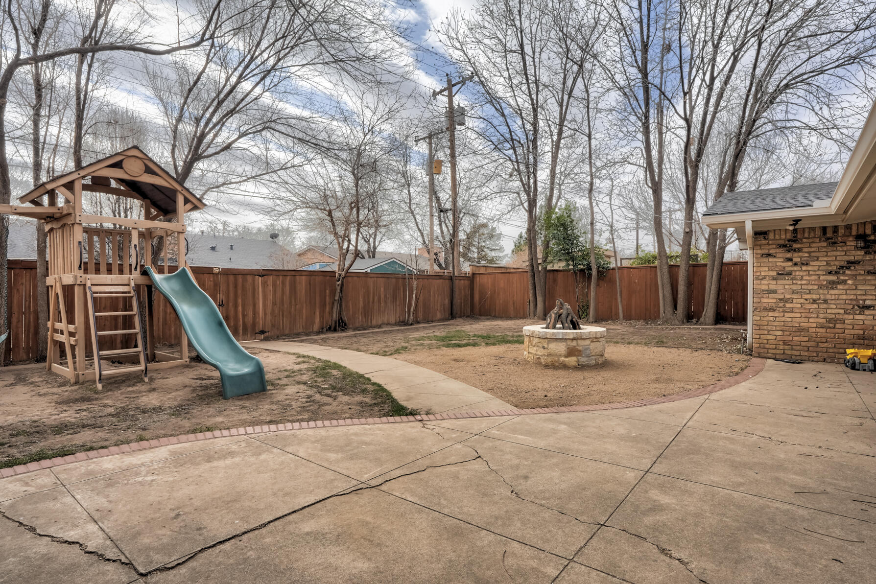 3303 53rd Street Lubbock, TX 79413 - Photo 68 of 72 a view of a park with swings and slides