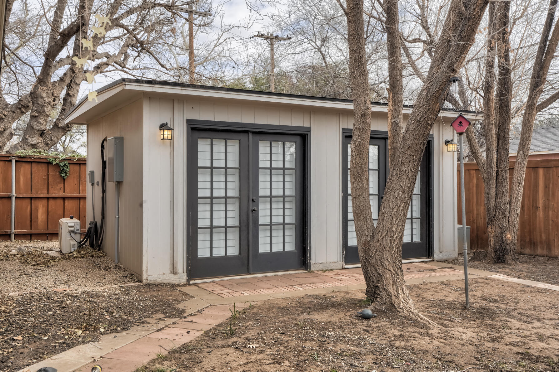 3303 53rd Street Lubbock, TX 79413 - Photo 70 of 72 a house with trees in front of it