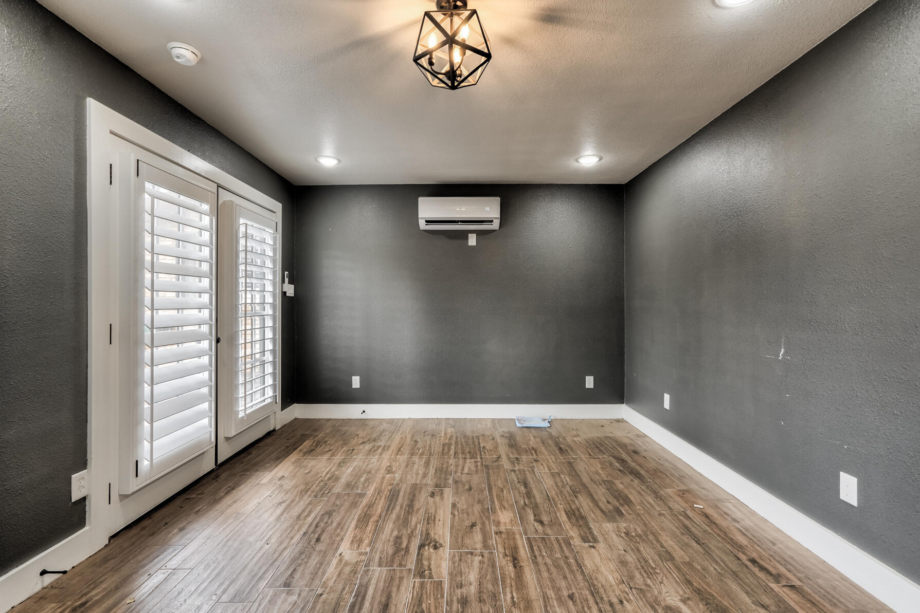 3303 53rd Street Lubbock, TX 79413 - Photo 72 of 72 wooden floor in an empty room with a window