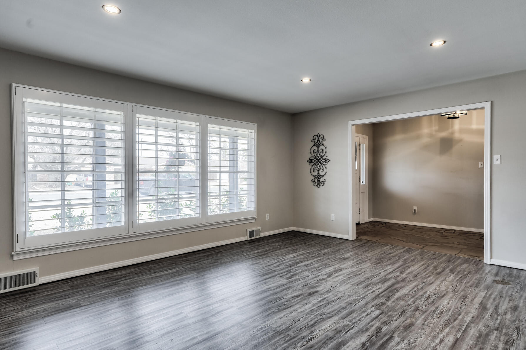 3303 53rd Street Lubbock, TX 79413 - Photo 9 of 72 an empty room with wooden floor and windows