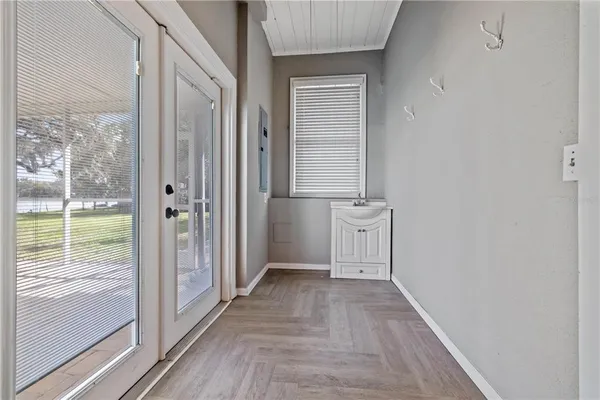 a view of a tennis ground with a large window