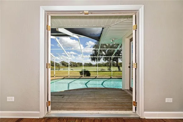 a view of a house with a yard and furniture