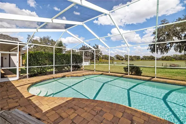 a view of outdoor space with green field and trees