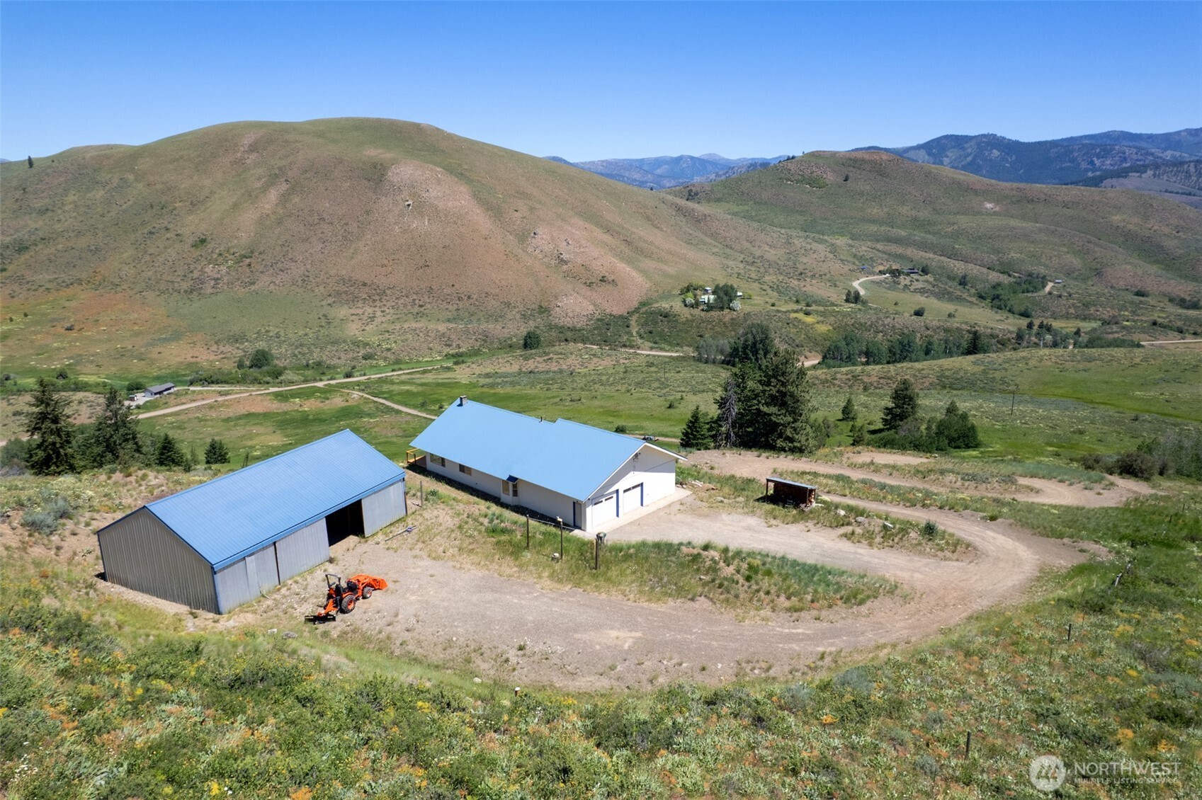 427 Rendezvous Road Winthrop, WA 98862 - Photo 40 of 40 an aerial view of a house with mountain view