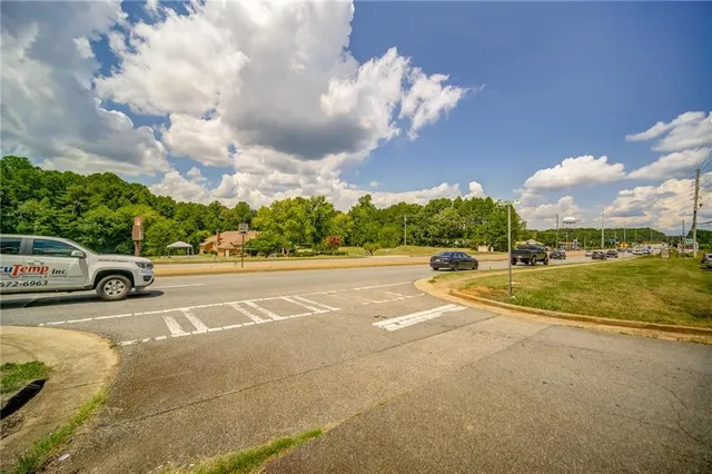 a view of a street with a building in the background