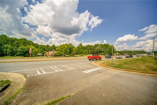 a view of a swimming pool with an outdoor space and seating area