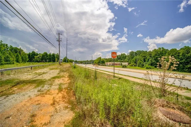 a view of a garden with a house