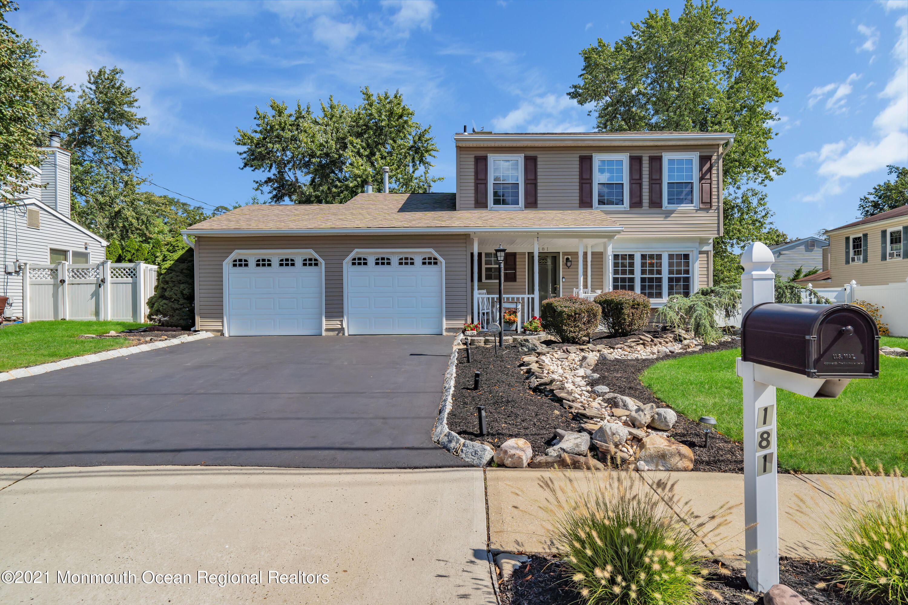181 Friendship Road Howell, NJ 07731 - Photo 1 of 36 a front view of a house with garden