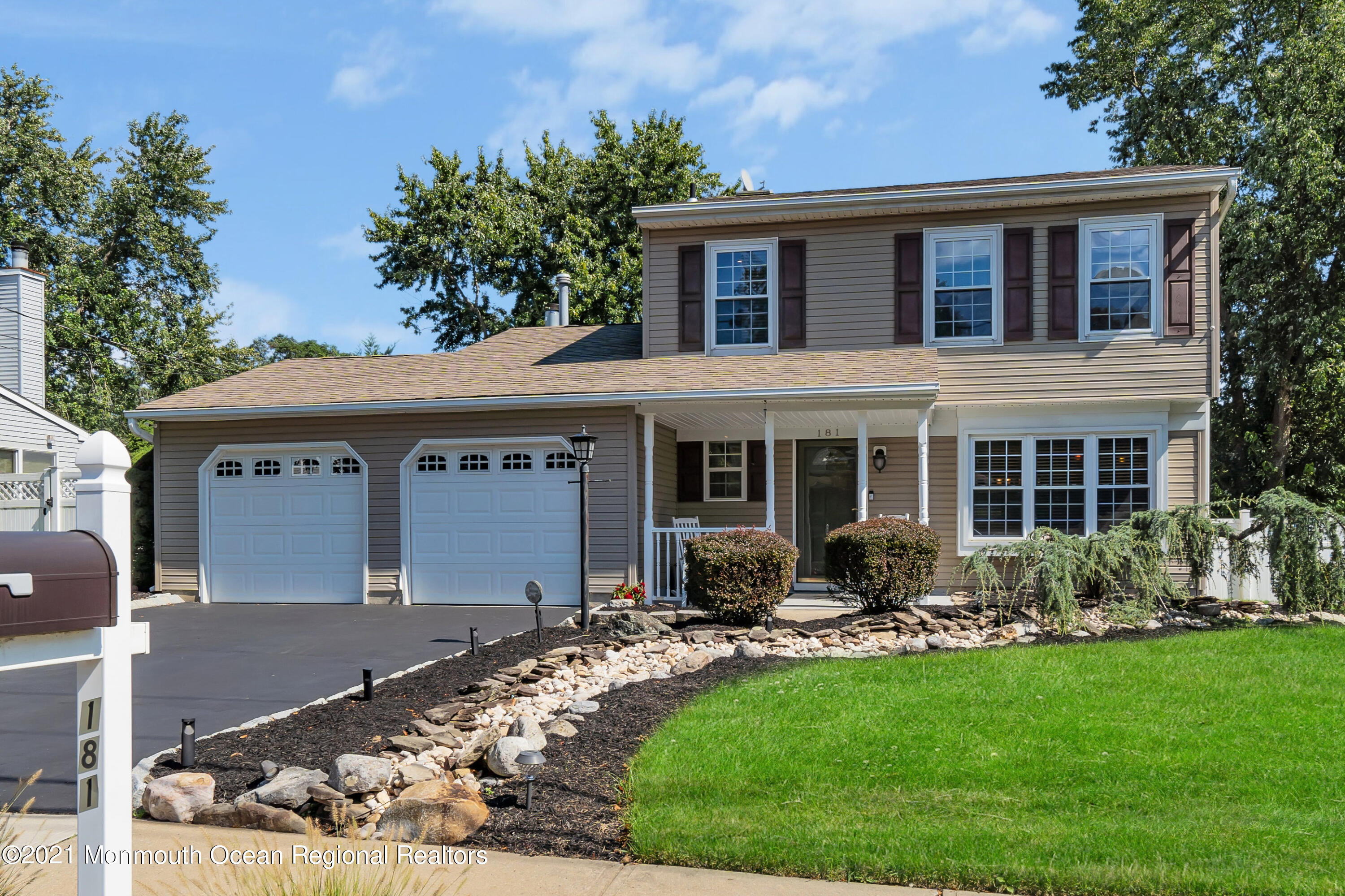 181 Friendship Road Howell, NJ 07731 - Photo 2 of 36 a front view of a house with garden and porch