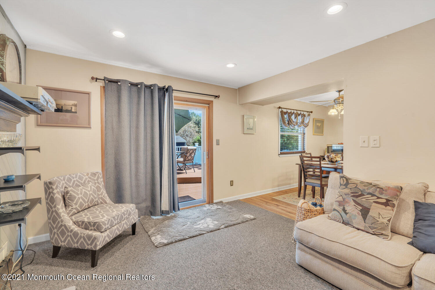 181 Friendship Road Howell, NJ 07731 - Photo 18 of 36 a living room with furniture and a dining table with kitchen view