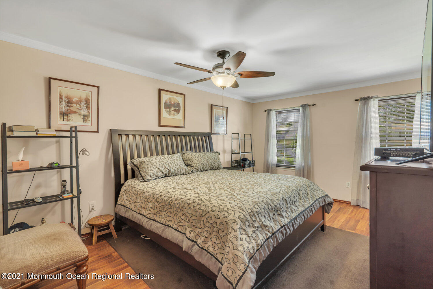 181 Friendship Road Howell, NJ 07731 - Photo 20 of 36 a bedroom with a large bed and a chandelier