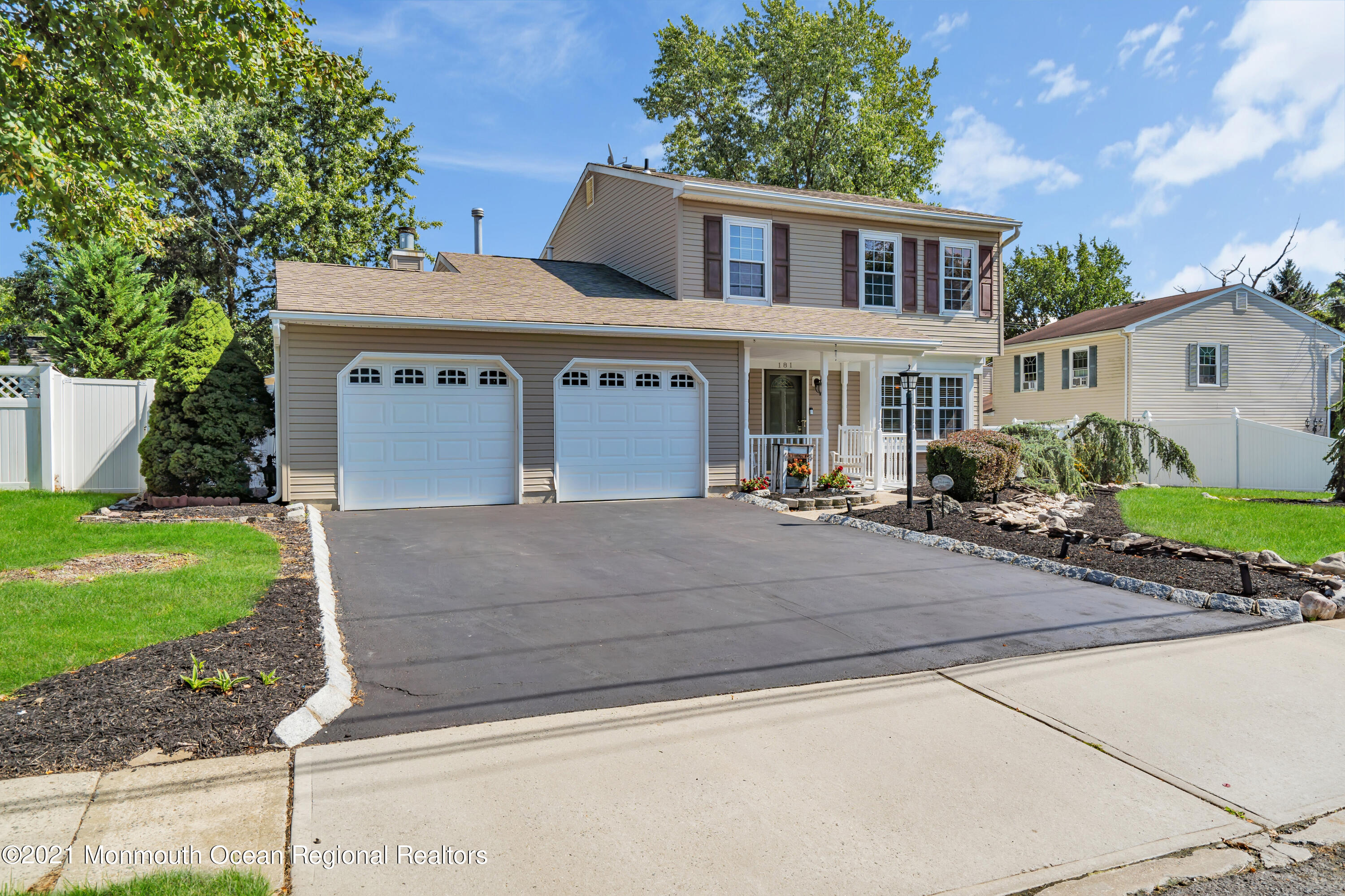 181 Friendship Road Howell, NJ 07731 - Photo 3 of 36 a front view of a house with garden