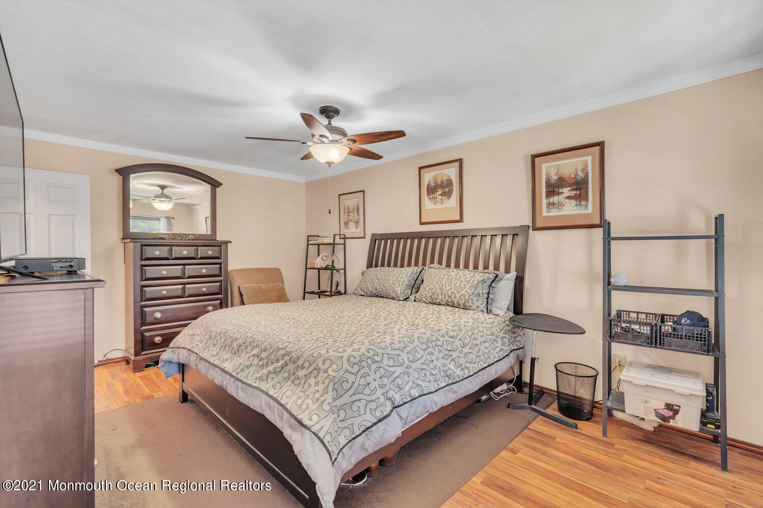 181 Friendship Road Howell, NJ 07731 - Photo 21 of 36 a bedroom with a bed chandelier and a window