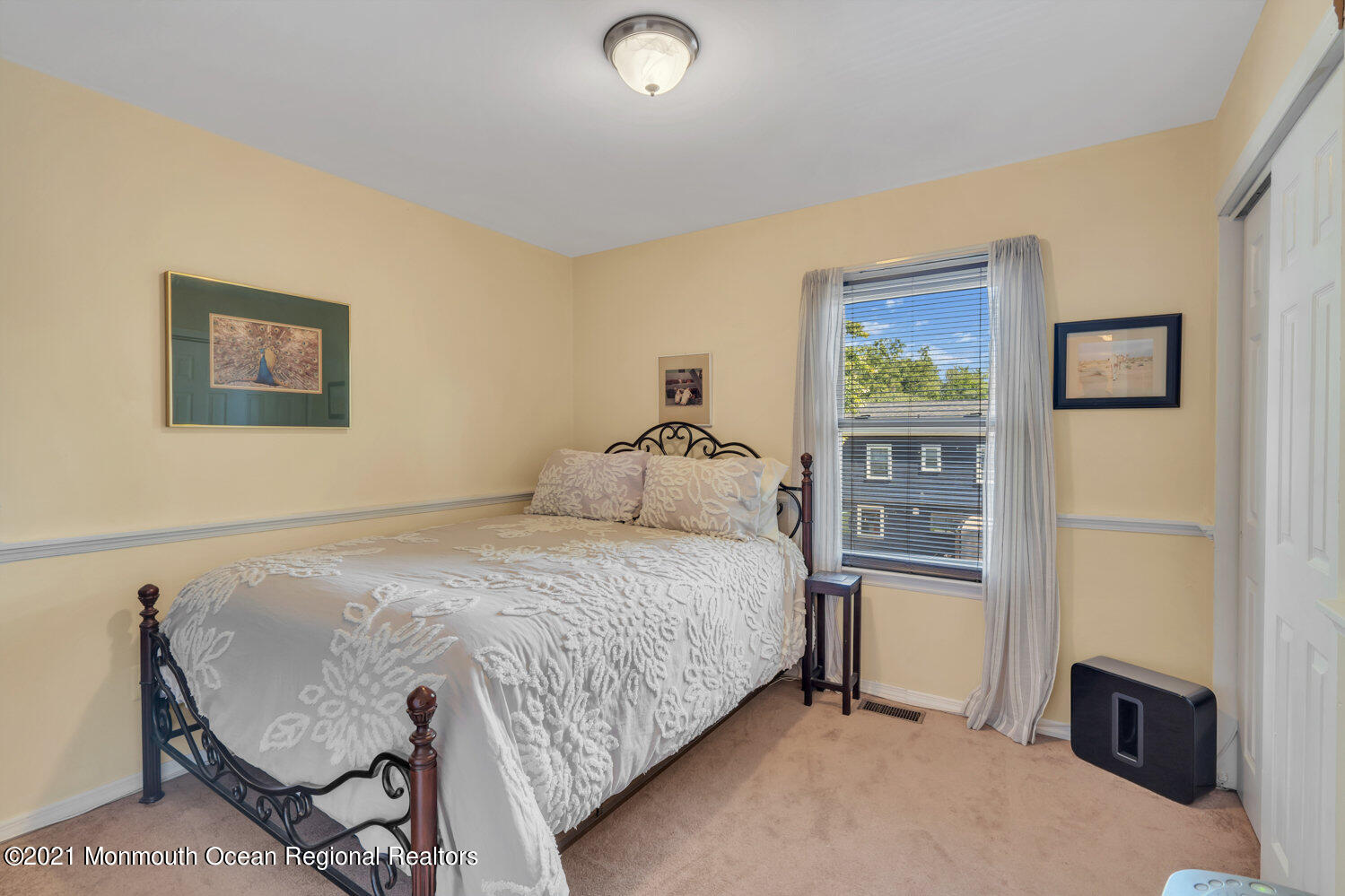 181 Friendship Road Howell, NJ 07731 - Photo 23 of 36 a bedroom with a bed and a desk