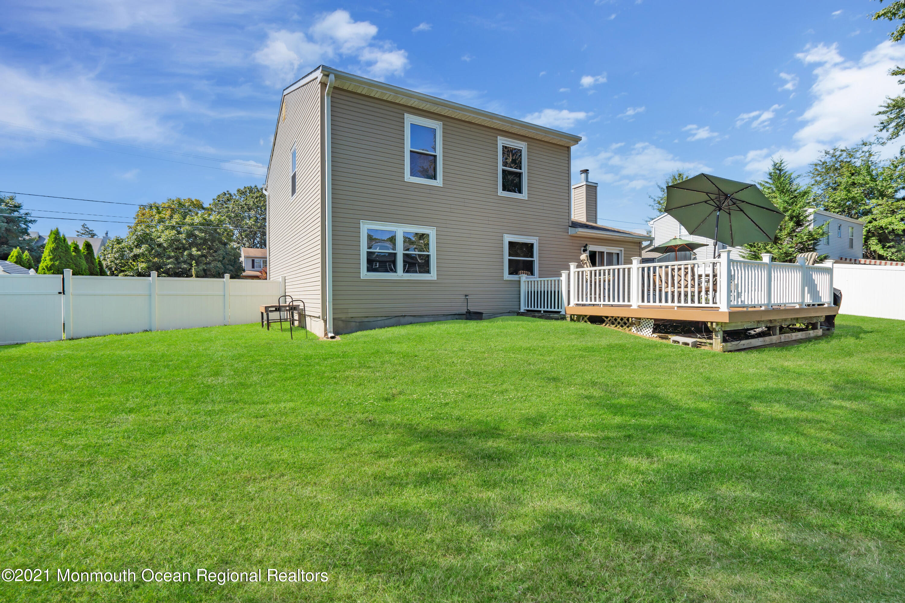 181 Friendship Road Howell, NJ 07731 - Photo 29 of 36 a front view of a house with a yard and trees