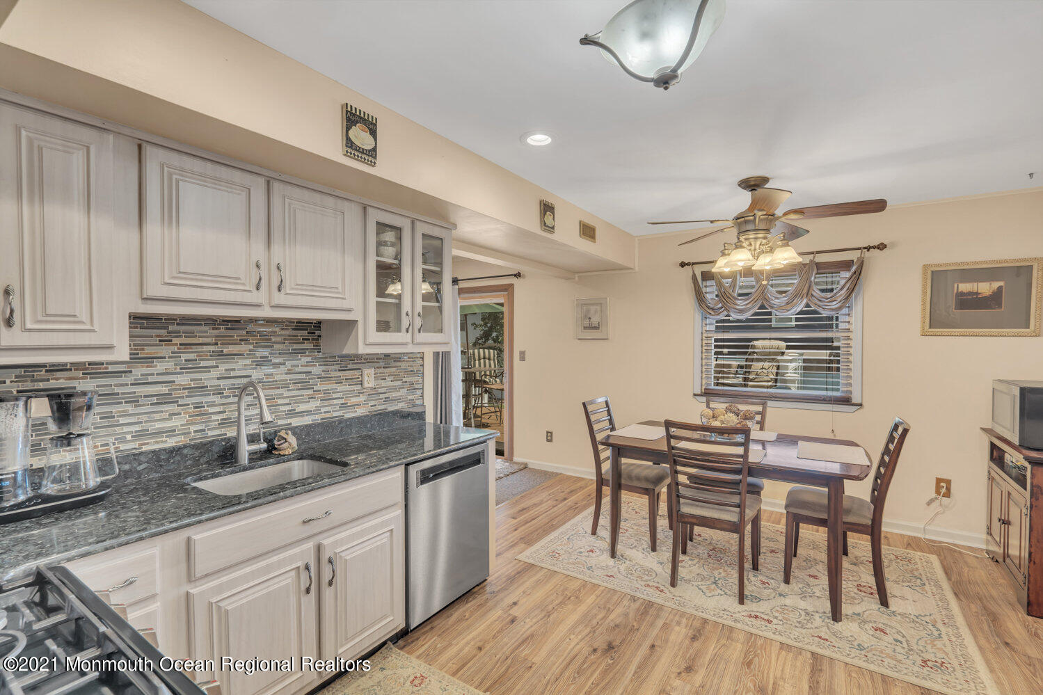 181 Friendship Road Howell, NJ 07731 - Photo 5 of 36 a kitchen with granite countertop a sink and cabinets