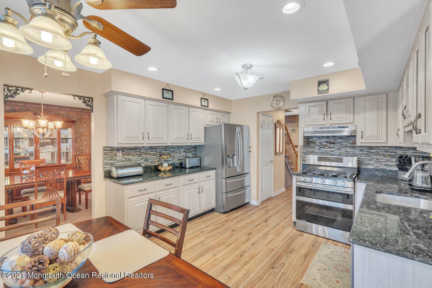 181 Friendship Road Howell, NJ 07731 - Photo 8 of 36 a kitchen with stainless steel appliances a stove a sink and cabinets
