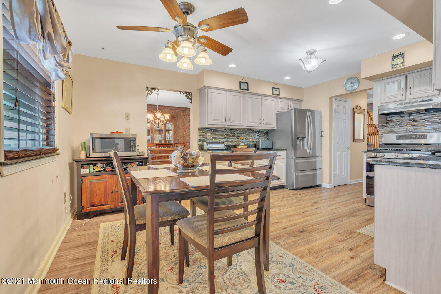 181 Friendship Road Howell, NJ 07731 - Photo 10 of 36 a view of a dining room with furniture and a chandelier