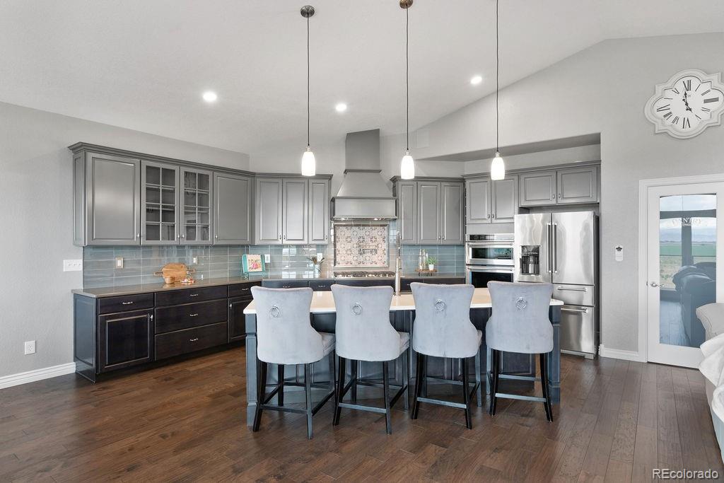 3050 Native Court Wellington, CO 80549 - Photo 13 of 50 a large kitchen with a table and chairs
