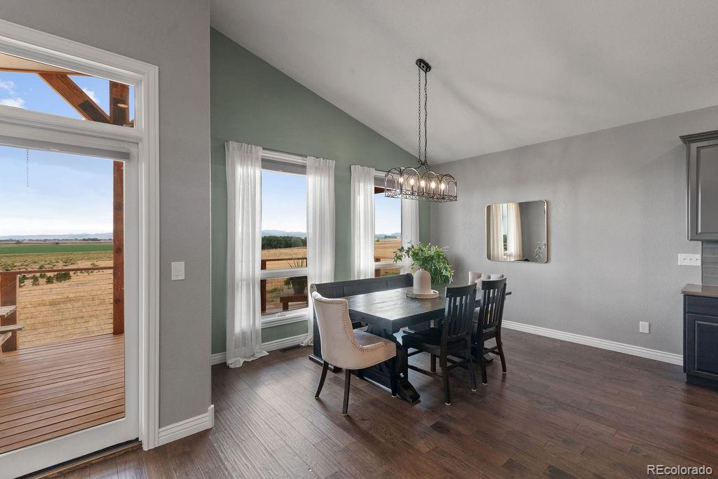 3050 Native Court Wellington, CO 80549 - Photo 18 of 50 a view of a dining room with furniture window and wooden floor
